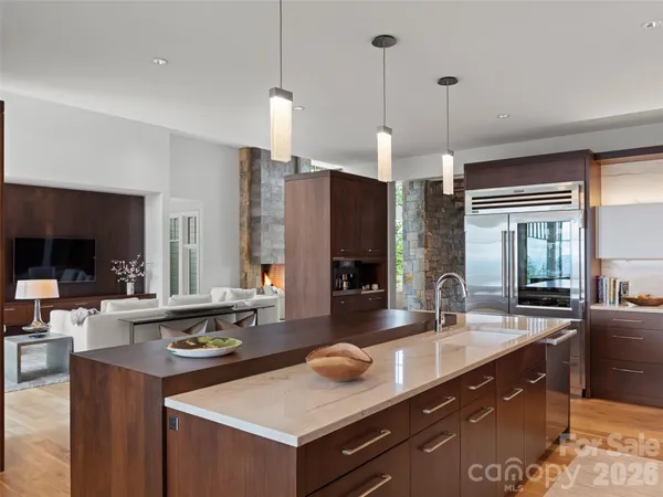 a kitchen with sink and refrigerator