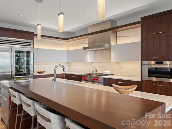 a kitchen with a sink a stove and a cabinets