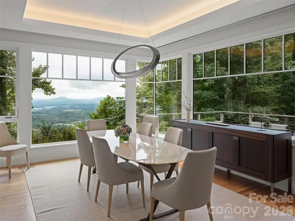 a view of a dining room with furniture window and outside view