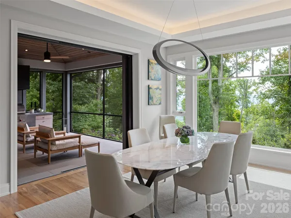 a view of a dining room with furniture window and outside view