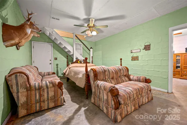 a bedroom with a bed and flat screen tv