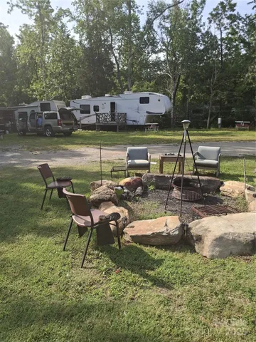 a view of a back yard from a lake view