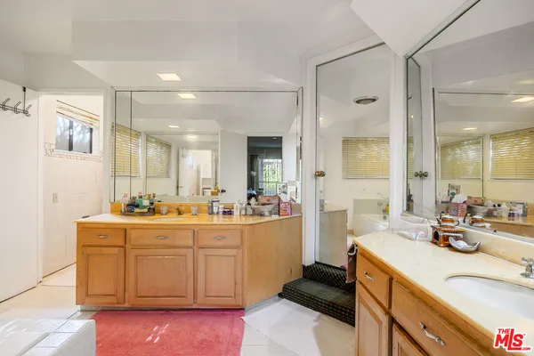 a large kitchen with a lot of counter space and sink