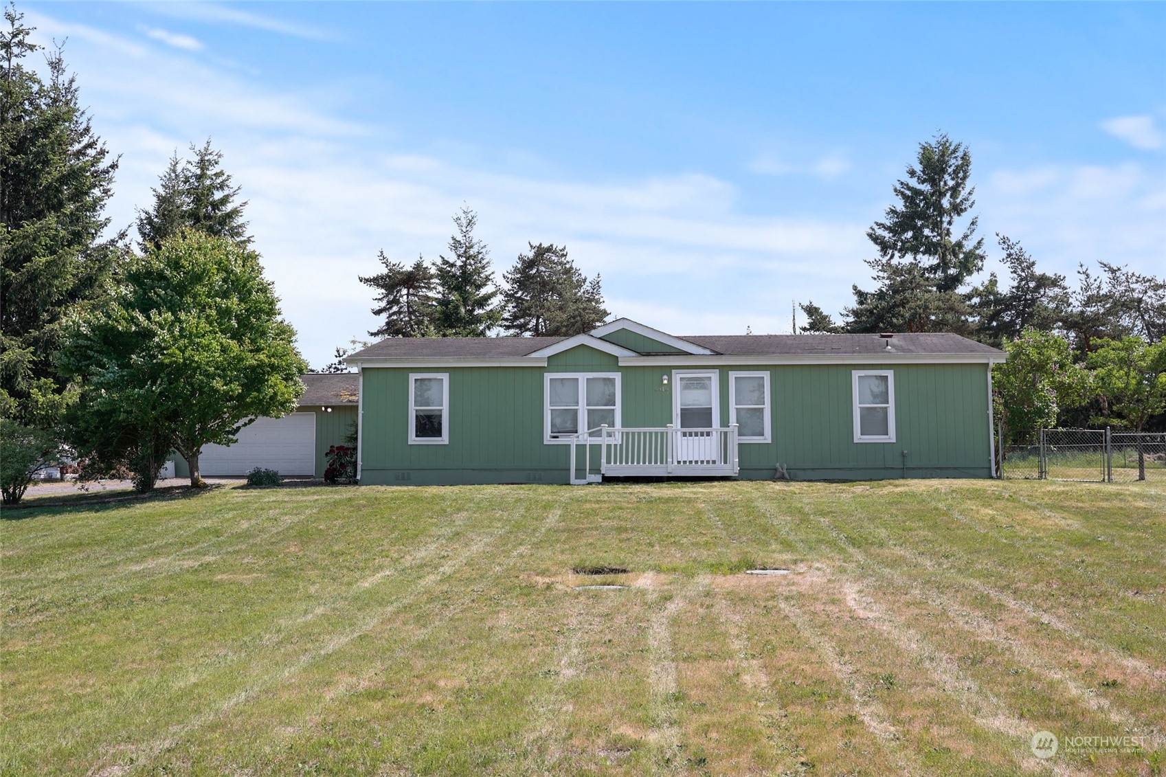 5815 190th Lane Southwest Rochester, WA 98579 - Photo 35 of 35 a view of a yard in front of a house with large tree