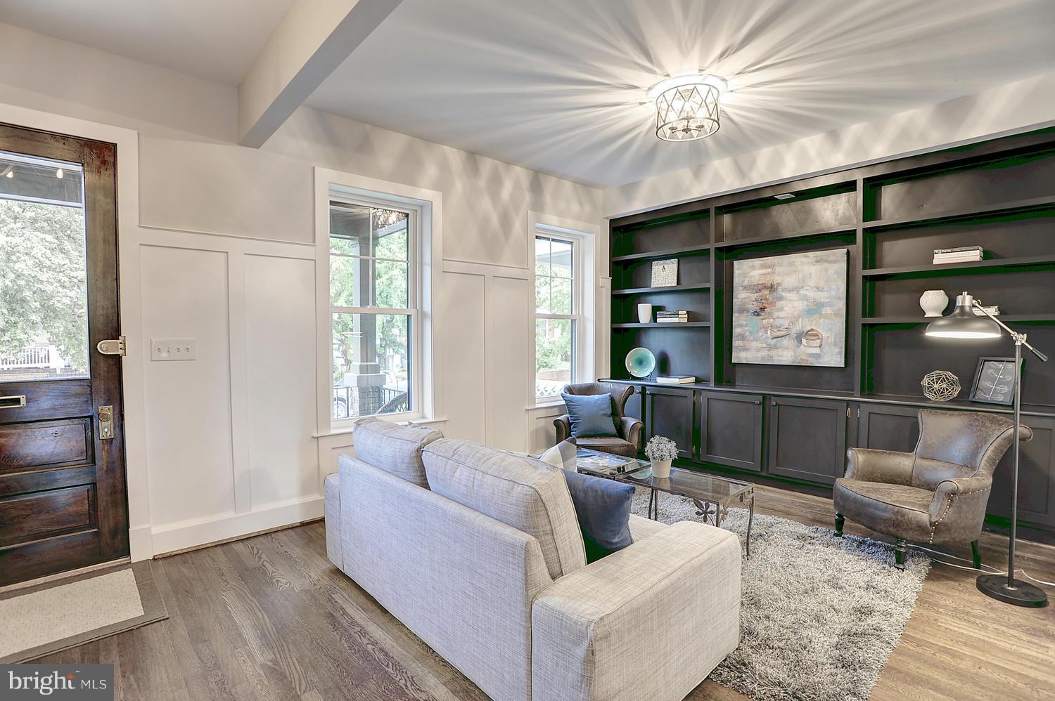 17 16th Street Southeast Washington, DC 20003 - Photo 2 of 29 a living room with furniture and a window