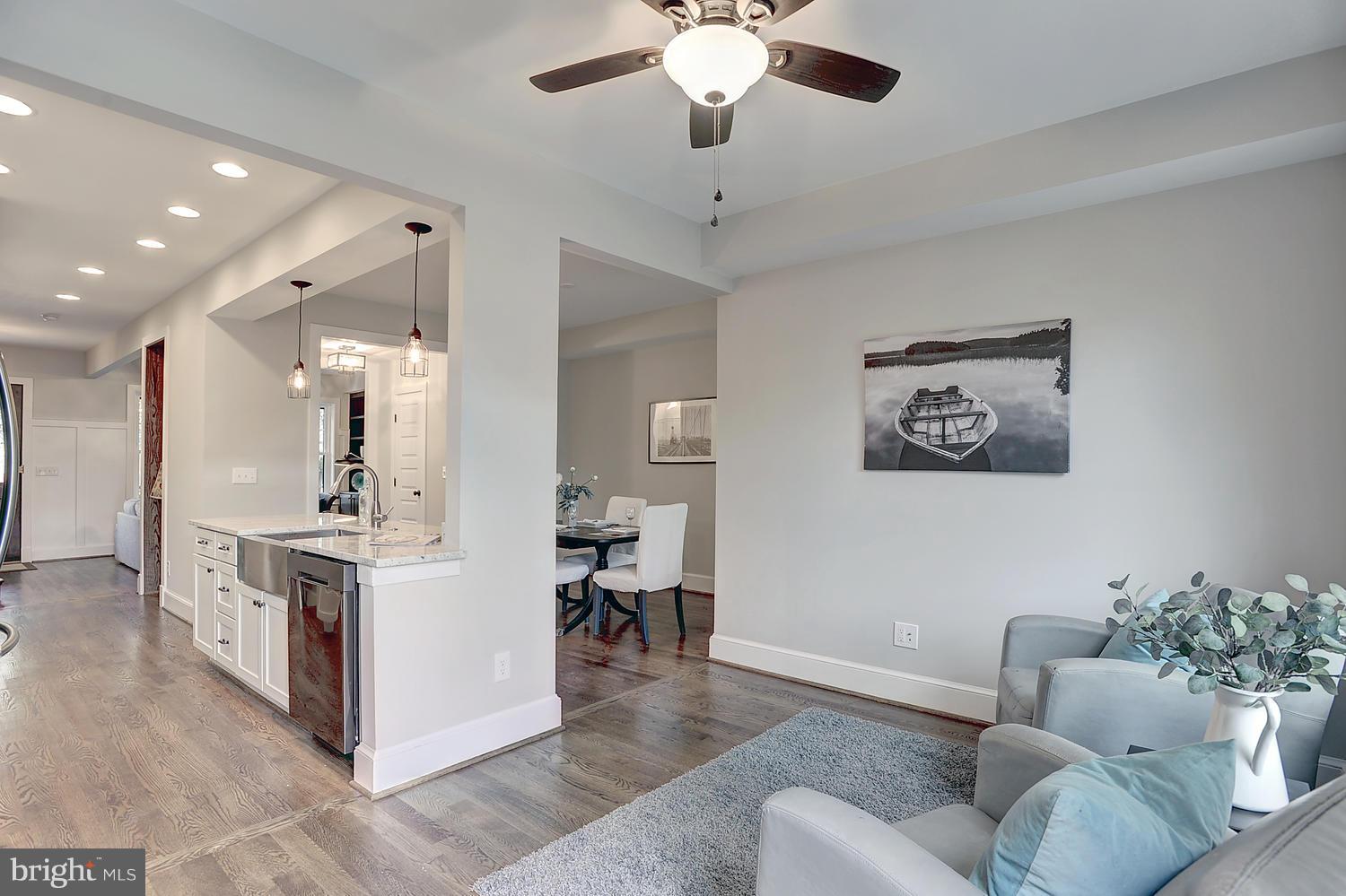 17 16th Street Southeast Washington, DC 20003 - Photo 11 of 29 a living room with furniture and a chandelier