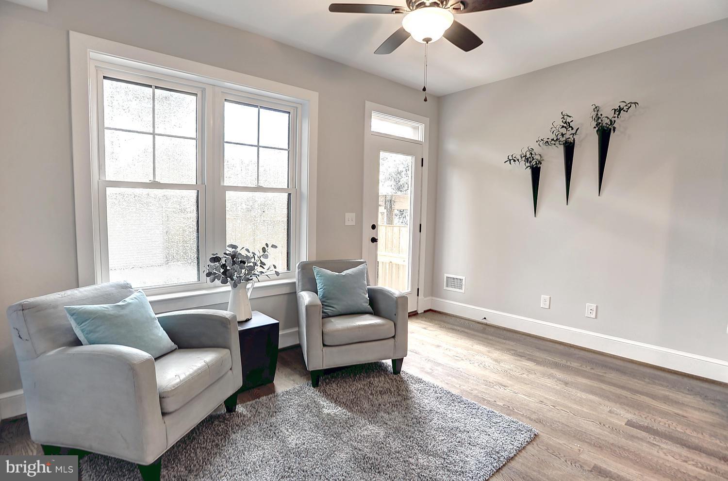 17 16th Street Southeast Washington, DC 20003 - Photo 12 of 29 a living room with furniture and a large window