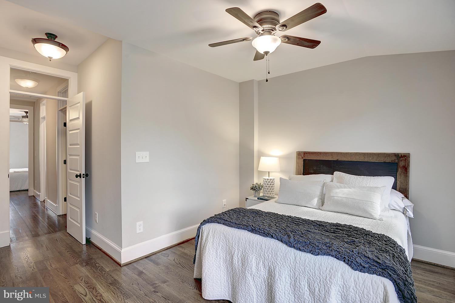 17 16th Street Southeast Washington, DC 20003 - Photo 19 of 29 a bedroom with a bed and a ceiling fan