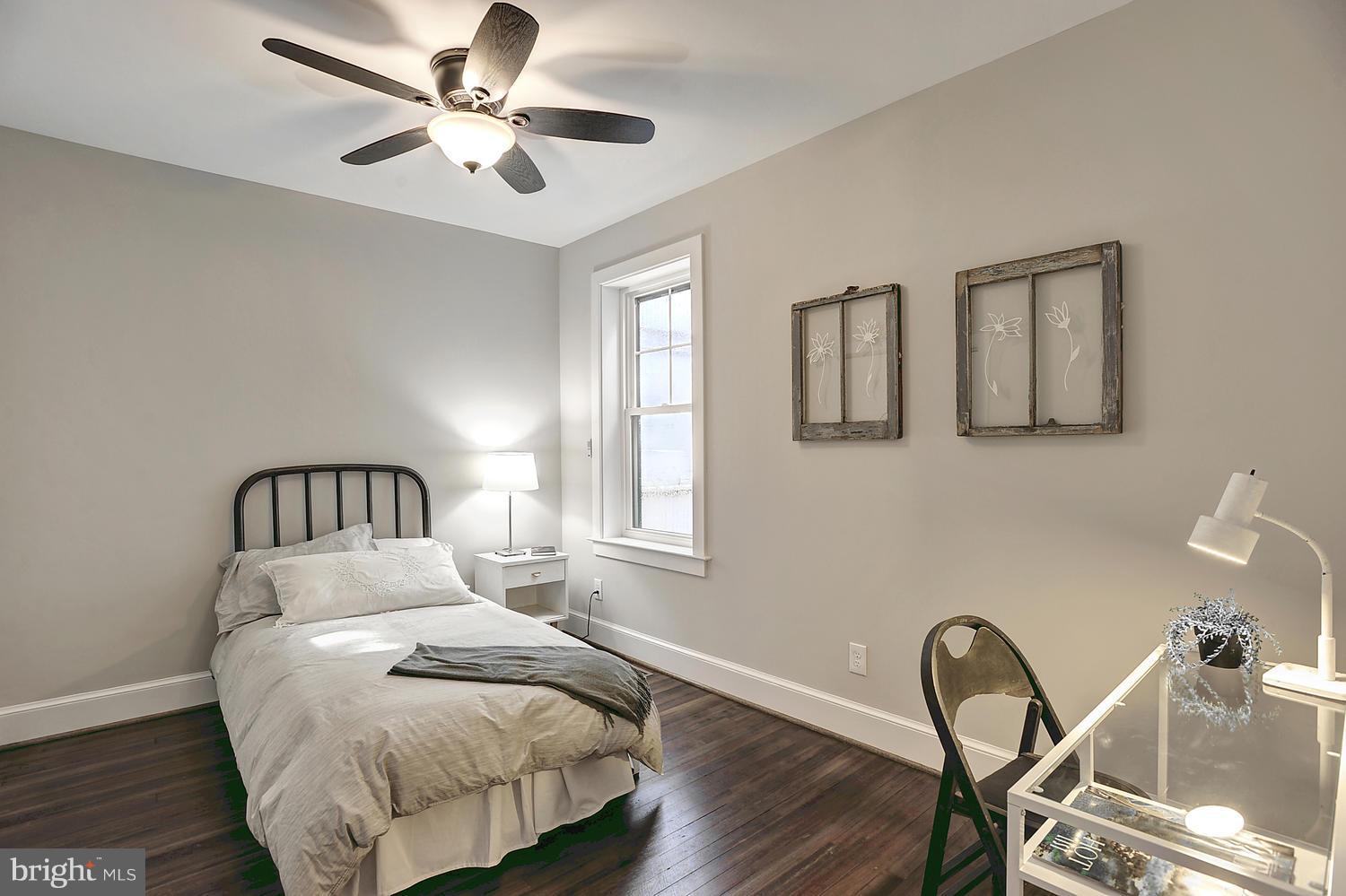 17 16th Street Southeast Washington, DC 20003 - Photo 20 of 29 a bedroom with a bed and a table