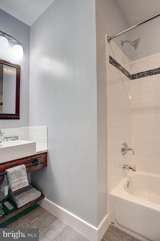 17 16th Street Southeast Washington, DC 20003 - Photo 22 of 29 a bathroom with a sink and a mirror