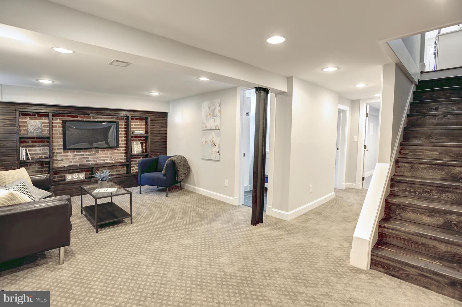 17 16th Street Southeast Washington, DC 20003 - Photo 23 of 29 a living room with furniture a flat screen tv and outdoor space