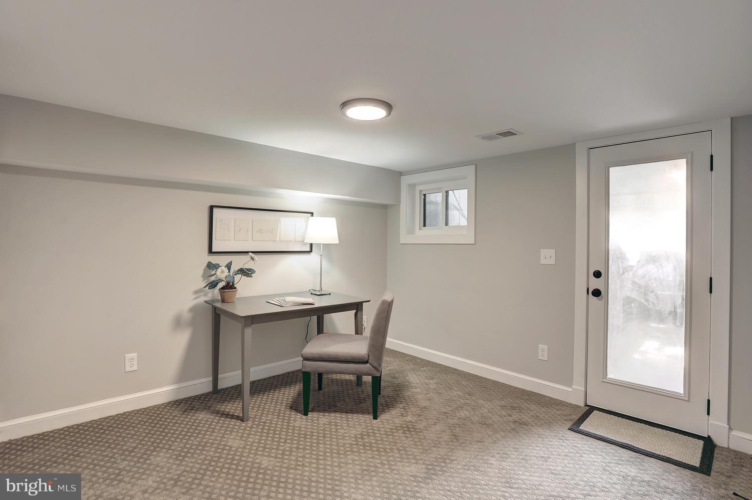 17 16th Street Southeast Washington, DC 20003 - Photo 25 of 29 a workspace with furniture and window in a room