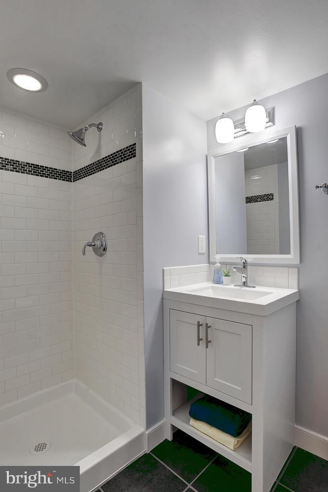 17 16th Street Southeast Washington, DC 20003 - Photo 27 of 29 a bathroom with a sink and a mirror