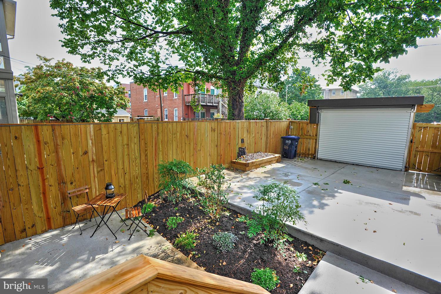 17 16th Street Southeast Washington, DC 20003 - Photo 28 of 29 a view of backyard with potted plants and a large tree