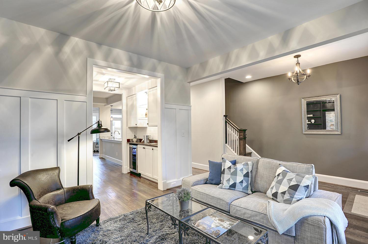 17 16th Street Southeast Washington, DC 20003 - Photo 4 of 29 a living room with furniture and a dining table