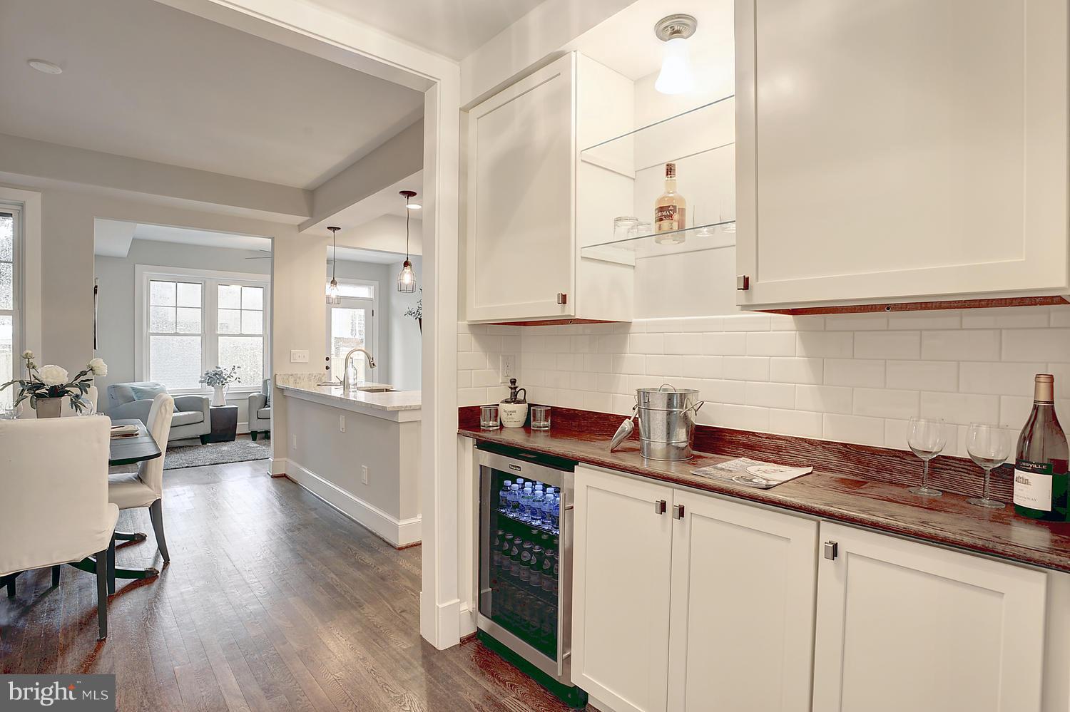 17 16th Street Southeast Washington, DC 20003 - Photo 6 of 29 a kitchen with stainless steel appliances granite countertop a stove and white cabinets