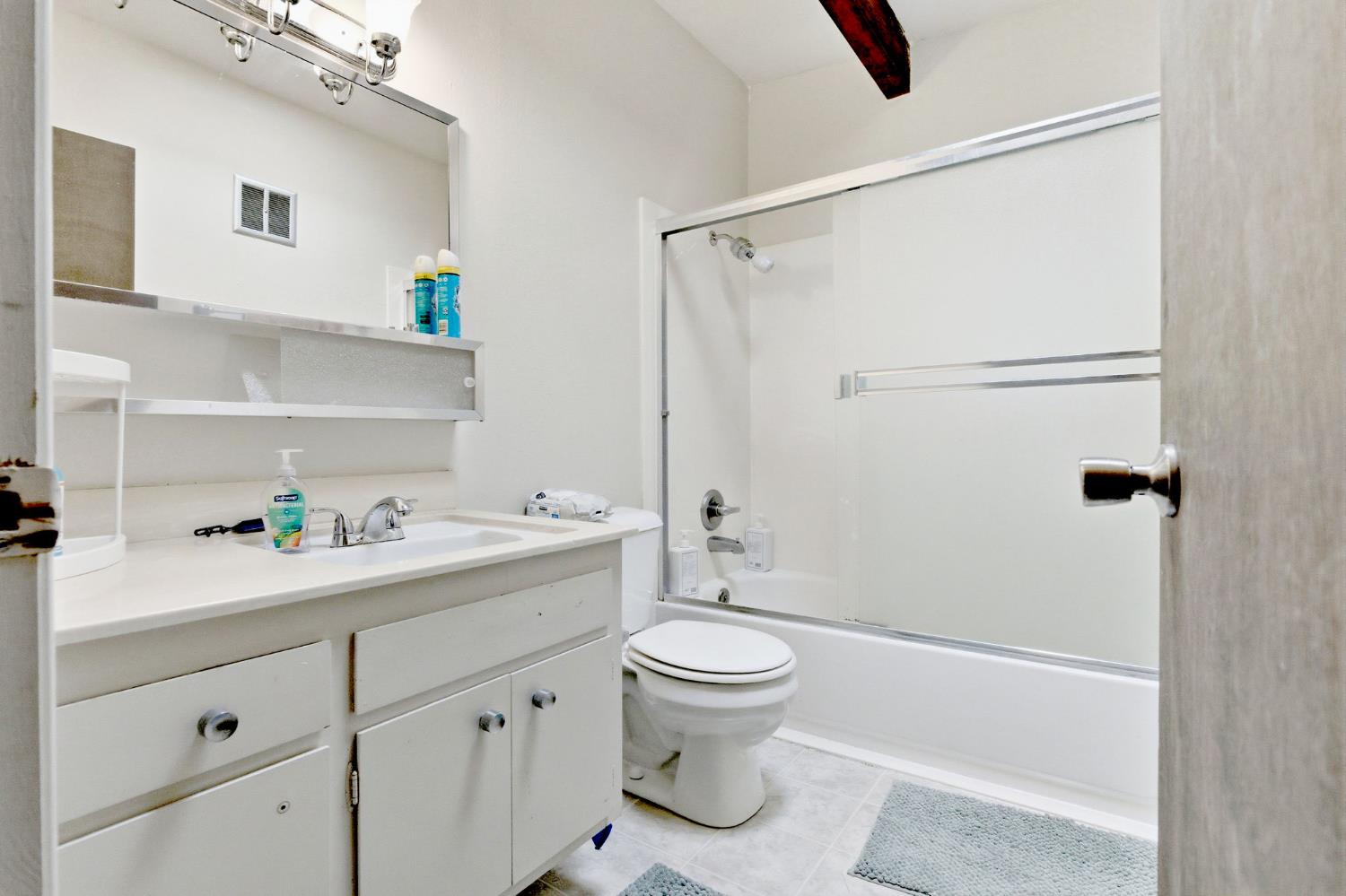 916 Drake Drive Davis, CA 95616 - Photo 16 of 19 a bathroom with a sink a toilet and shower
