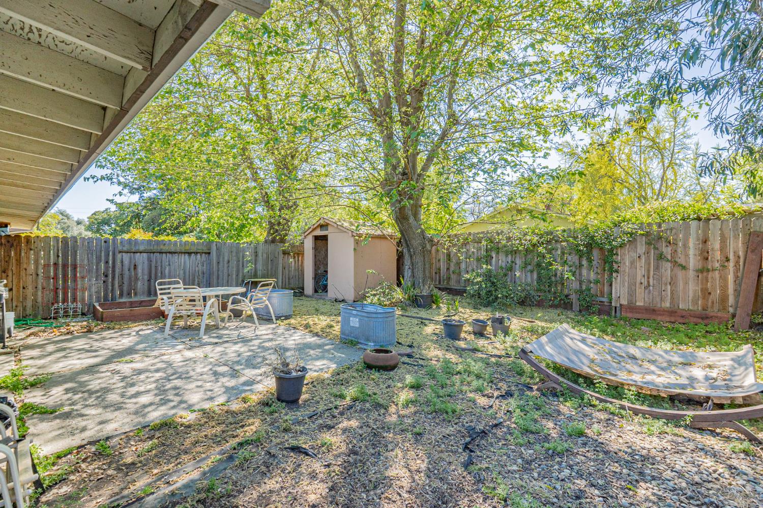 916 Drake Drive Davis, CA 95616 - Photo 19 of 19 a backyard of a house with table and chairs