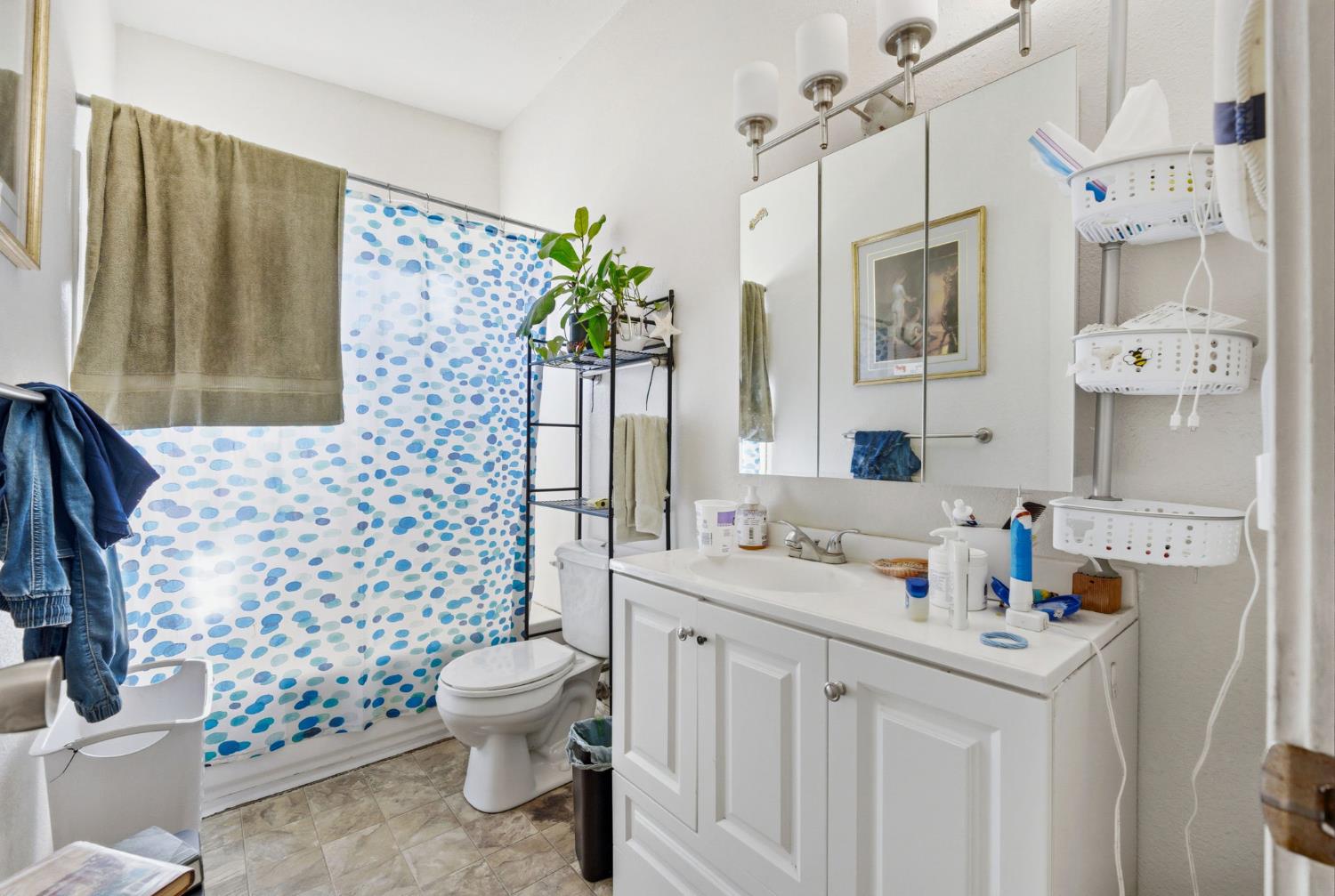 916 Drake Drive Davis, CA 95616 - Photo 3 of 19 a bathroom with a sink toilet vanity and shower