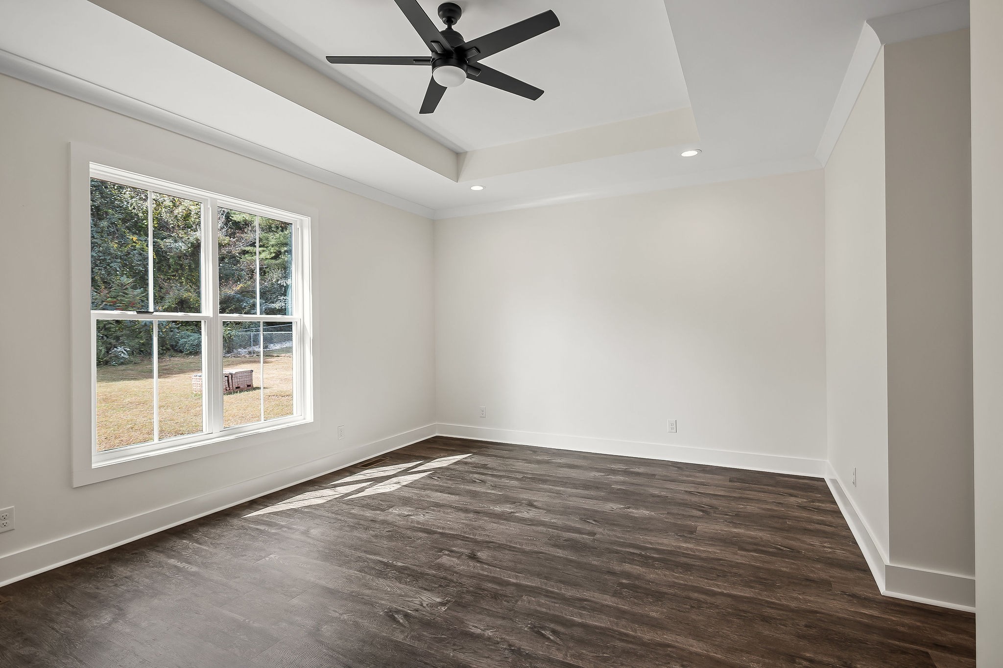 146 Simons Boulevard Morrison, TN 37357 - Photo 14 of 28 an empty room with wooden floor fan and windows