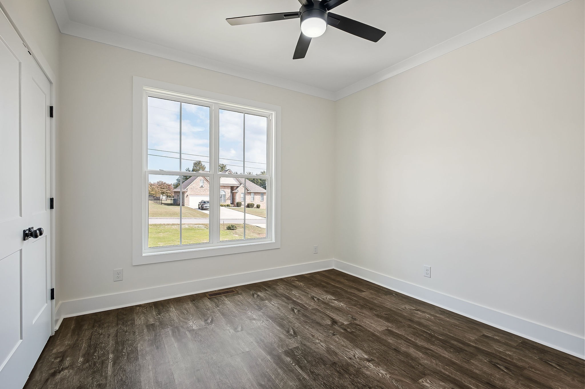 146 Simons Boulevard Morrison, TN 37357 - Photo 19 of 28 an empty room with wooden floor fan and windows