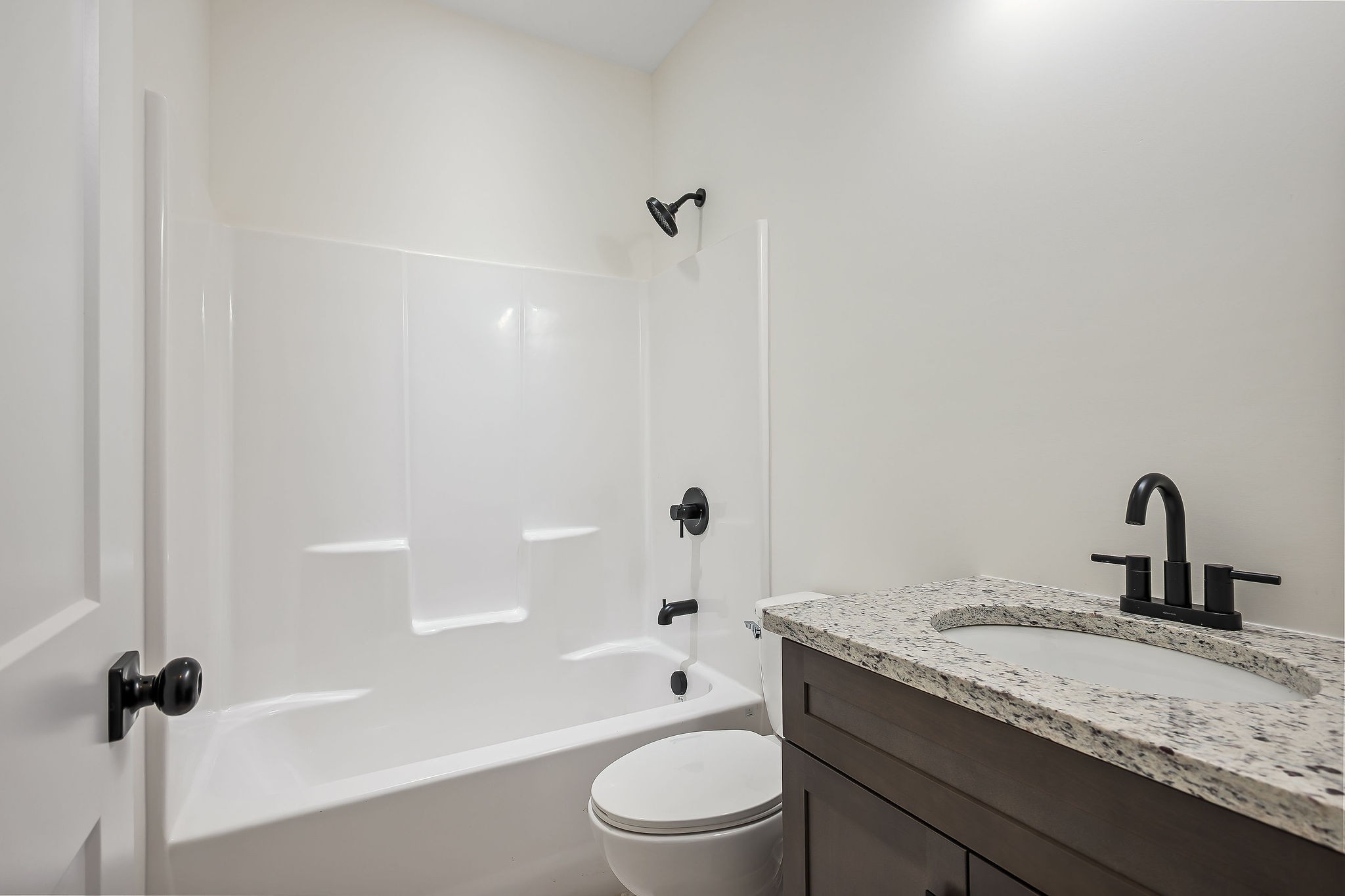 146 Simons Boulevard Morrison, TN 37357 - Photo 20 of 28 a bathroom with a granite countertop sink toilet a mirror and shower