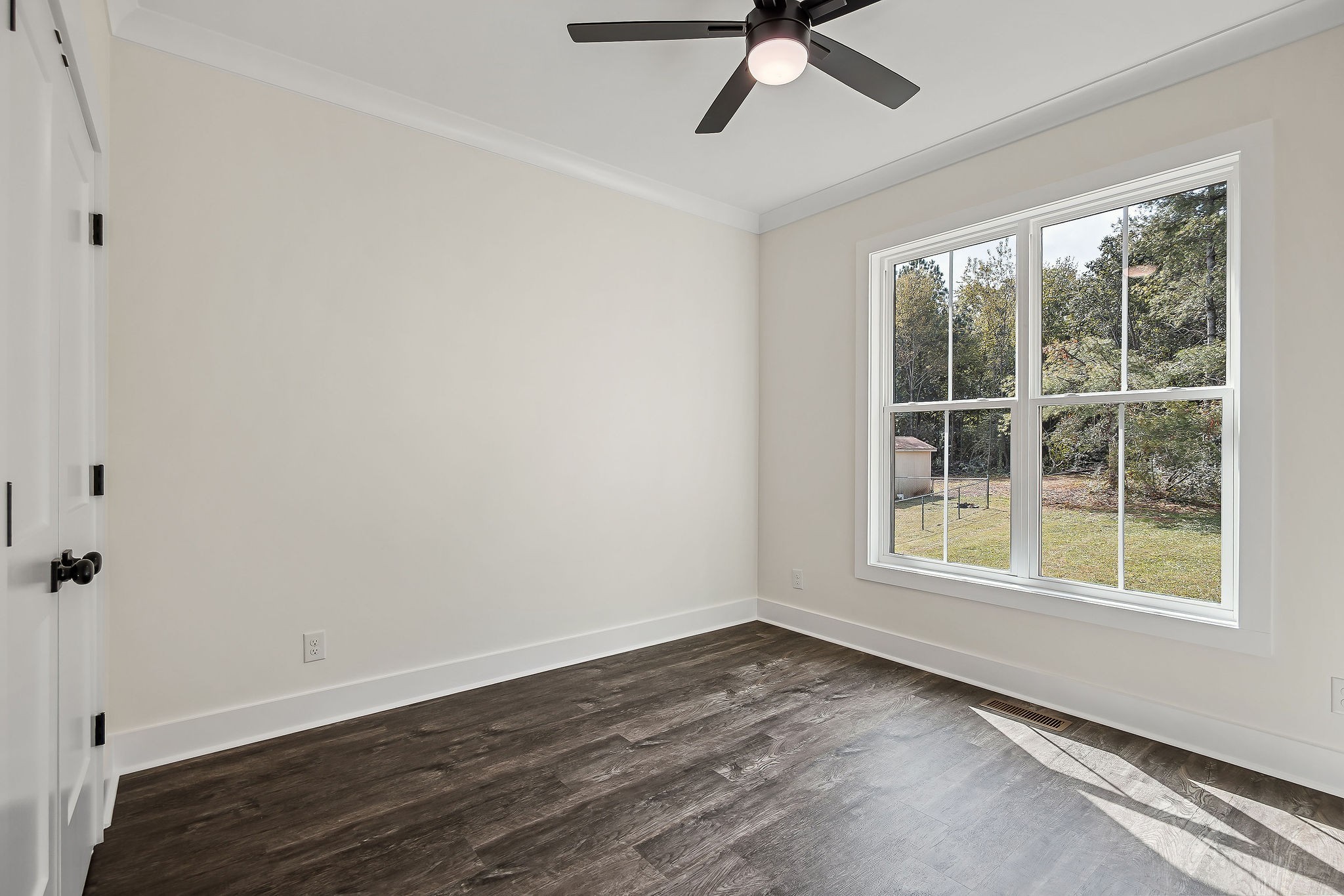 146 Simons Boulevard Morrison, TN 37357 - Photo 21 of 28 wooden floor in an empty room with a window