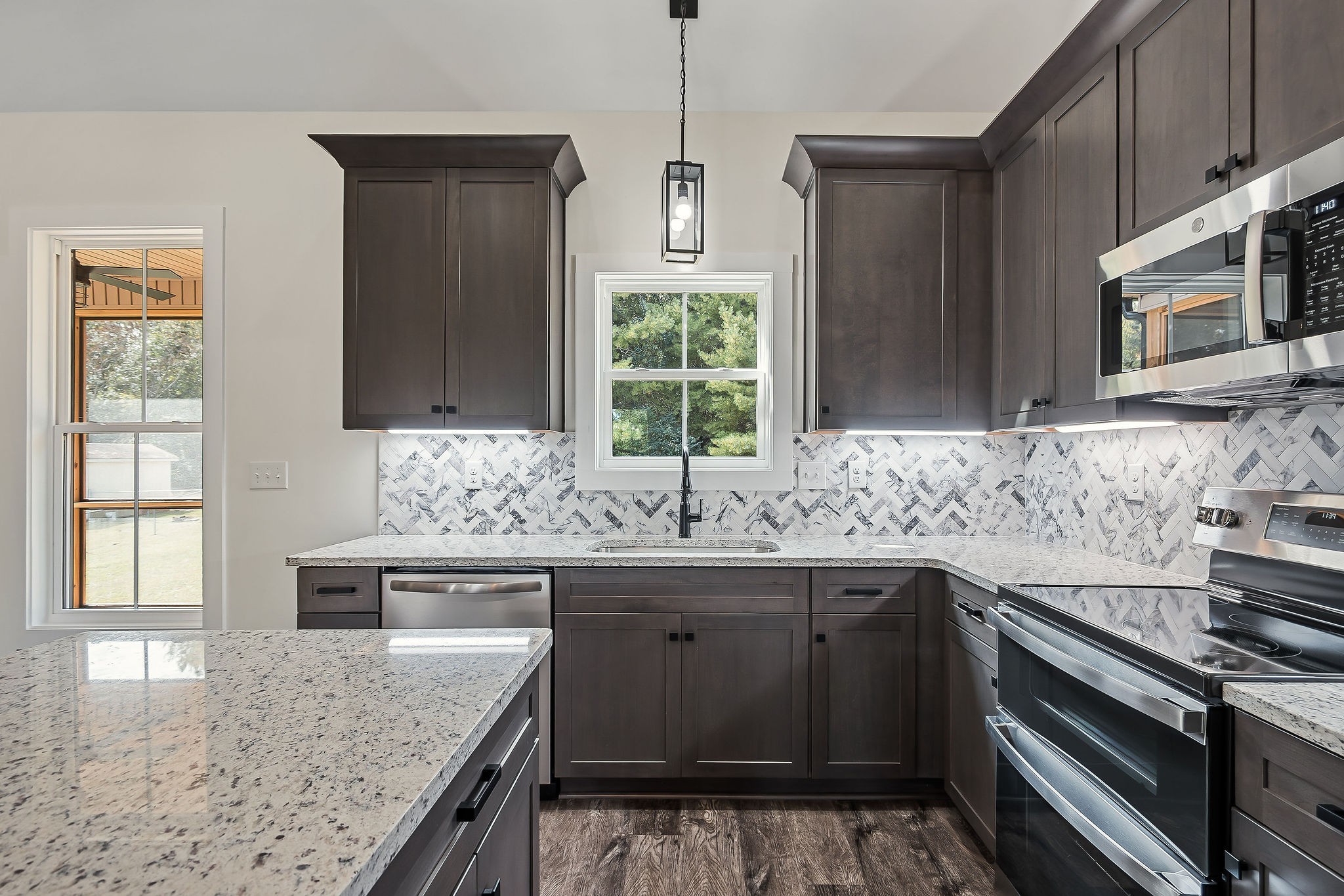 146 Simons Boulevard Morrison, TN 37357 - Photo 5 of 28 a kitchen with stainless steel appliances granite countertop a sink stove and microwave