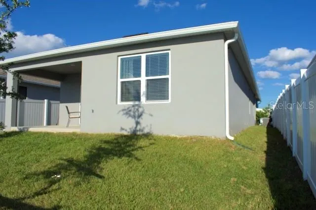 a view of front door and yard