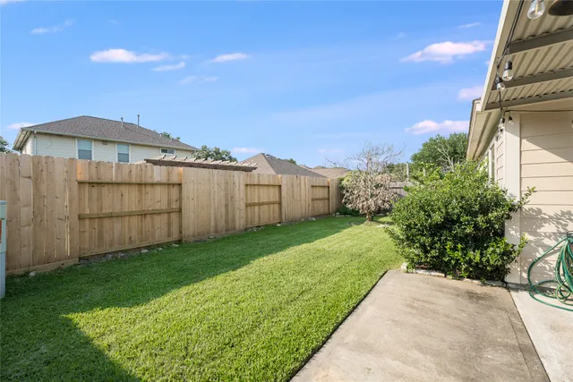a view of a backyard with potted plants
