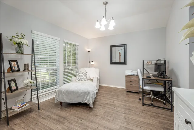 a bedroom with bed and window
