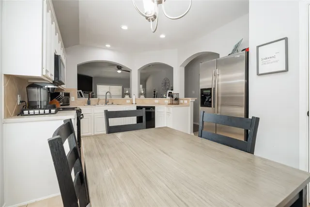 a kitchen with stainless steel appliances a refrigerator and a sink