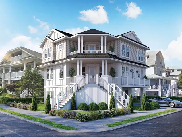 a front view of a residential apartment building with a yard