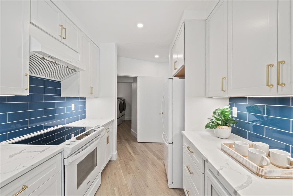 44 Ober Road, Unit 44 Newton, MA 02459 - Photo 11 of 41 a kitchen with a sink stove and refrigerator