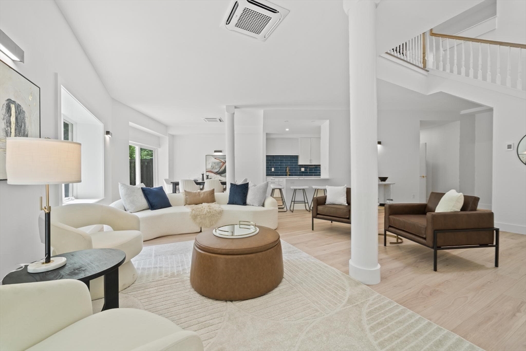44 Ober Road, Unit 44 Newton, MA 02459 - Photo 2 of 41 a living room with furniture a rug and white walls
