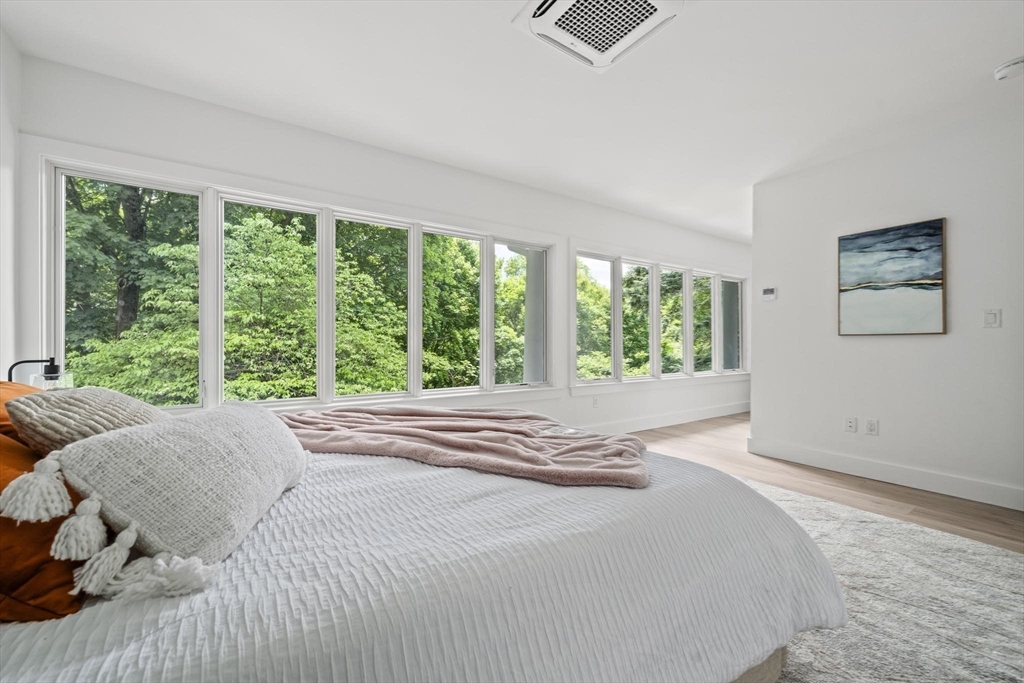 44 Ober Road, Unit 44 Newton, MA 02459 - Photo 27 of 41 a bedroom with a large bed and a window