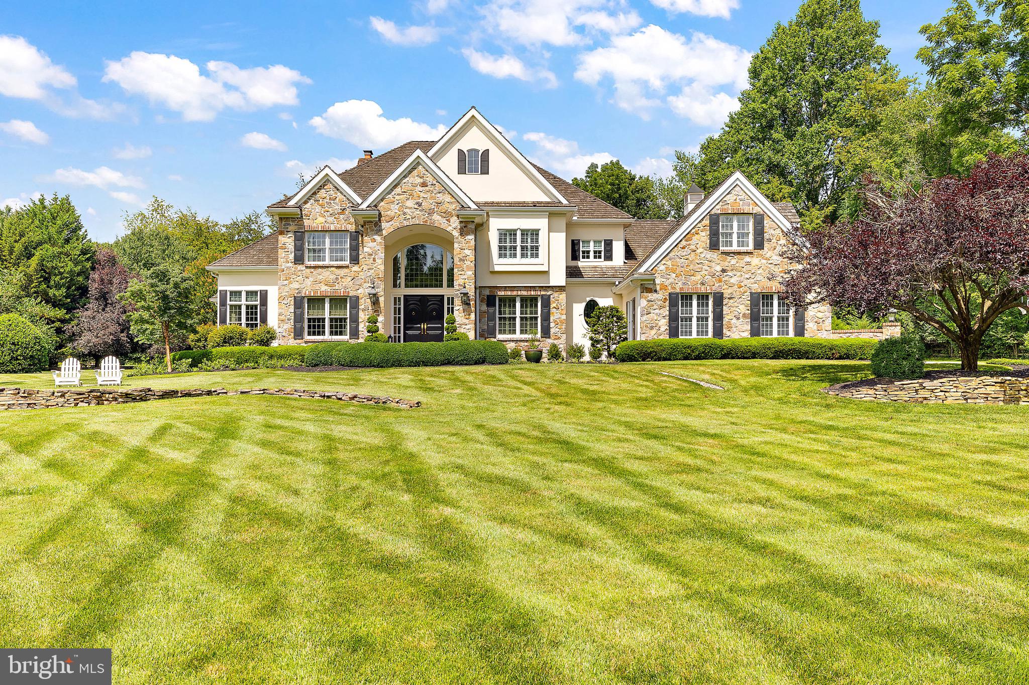 880 9 Gates Road Hockessin, DE 19707 - Photo 1 of 1 a front view of a house with a yard