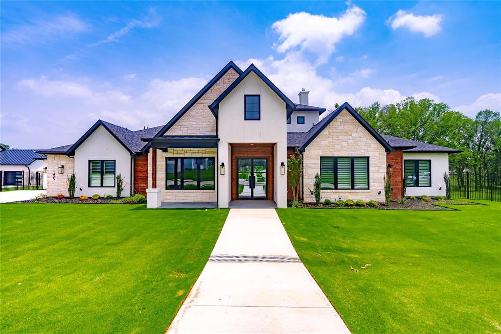 a front view of house with yard and green space