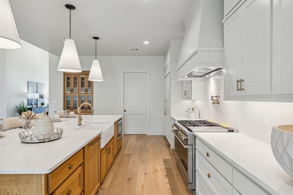 1405 Chelsea Rae Lane Keller, TX 76262 - Photo 13 of 35 a kitchen with sink stove and cabinets