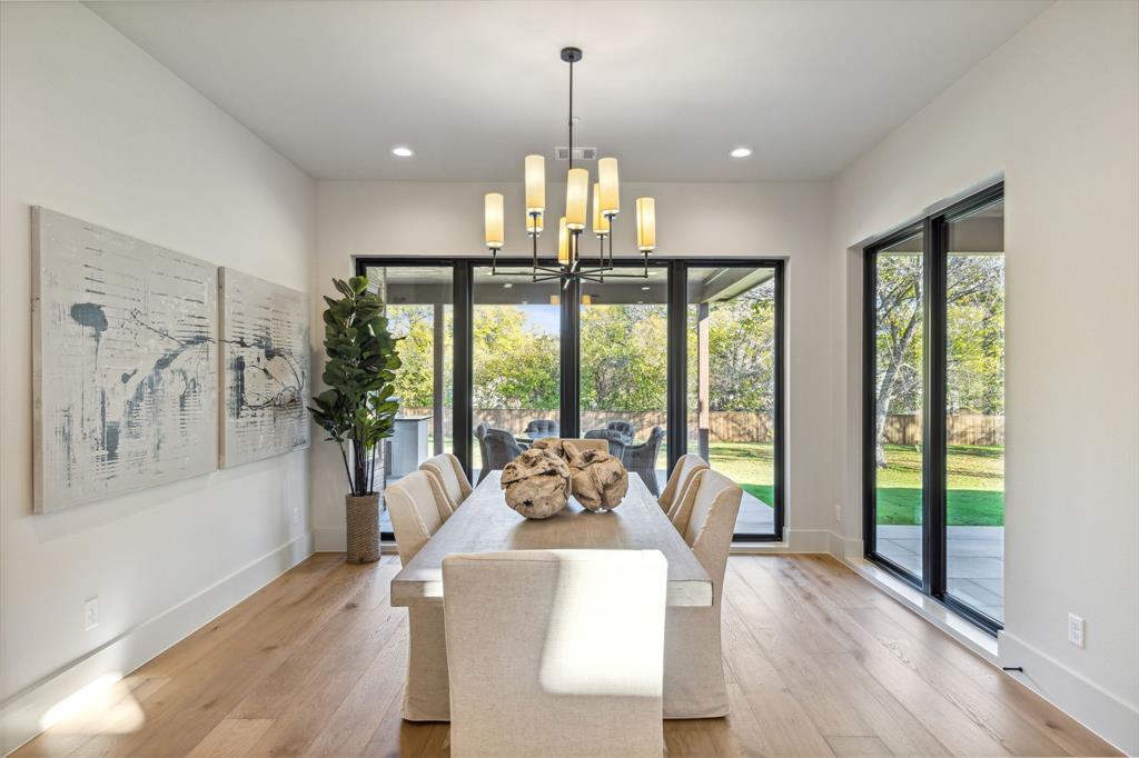 1405 Chelsea Rae Lane Keller, TX 76262 - Photo 14 of 35 a living room with furniture a chandelier and wooden floor