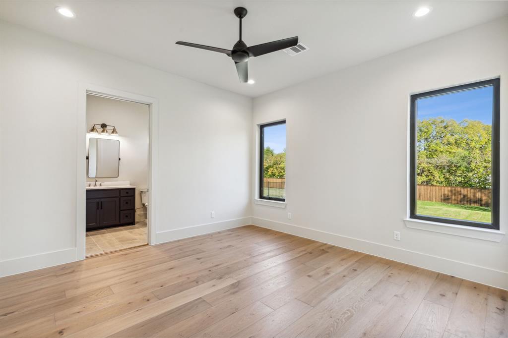 1405 Chelsea Rae Lane Keller, TX 76262 - Photo 19 of 35 a view of an empty room with a window and wooden floor