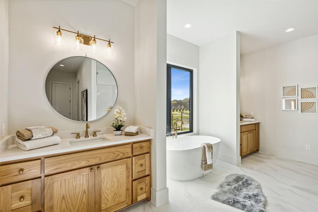 1405 Chelsea Rae Lane Keller, TX 76262 - Photo 24 of 35 a bathroom with a toilet a sink and a mirror