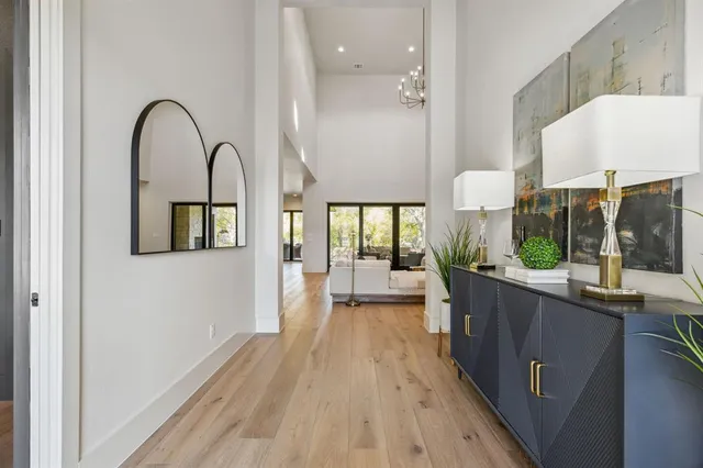 a view of a kitchen from a dining room with a large window