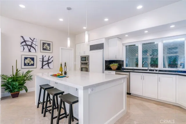 a kitchen with a table and chairs in it