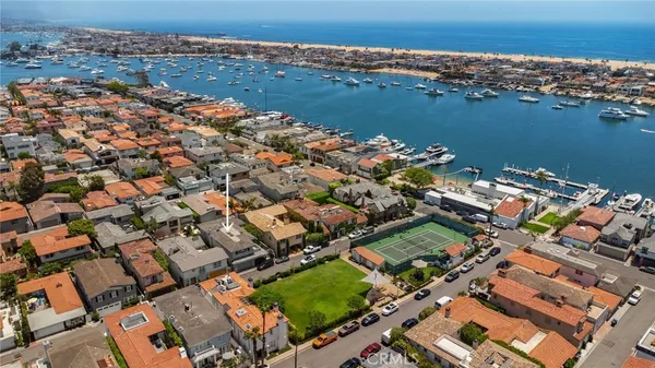 an aerial view of a city with ocean view