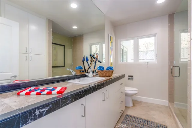 an aerial view of a house with a lake