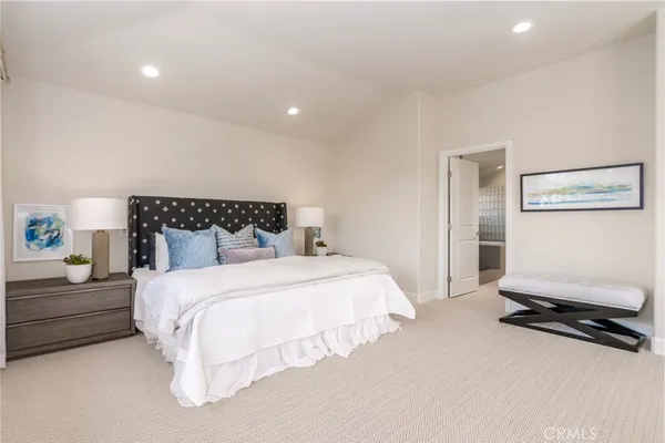 a bed room with a bed and a large window