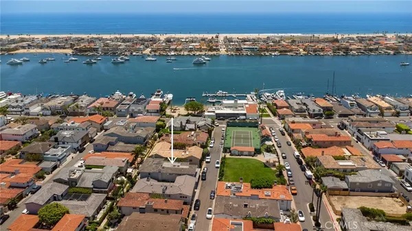 an aerial view of a city with ocean view