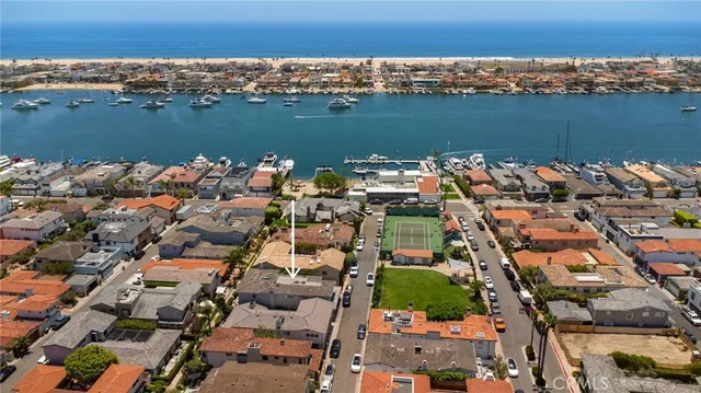 an aerial view of a city with ocean view