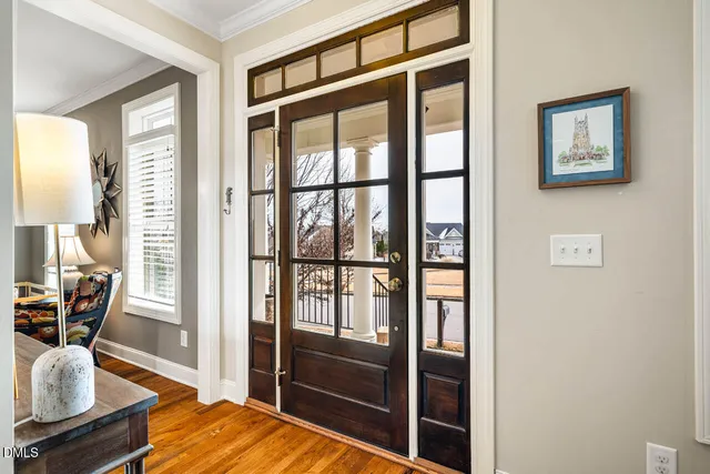 a kitchen with granite countertop white cabinets and a stove